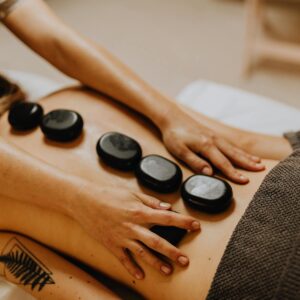 A soothing hot stone massage therapy session for relaxation and wellness.